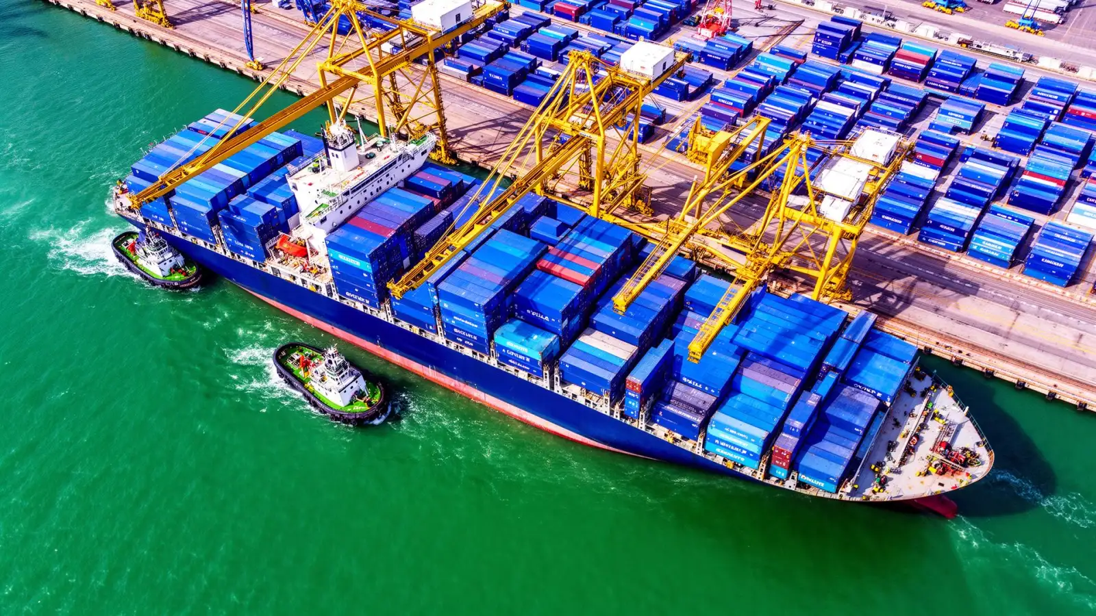 Container ship being loaded at a port